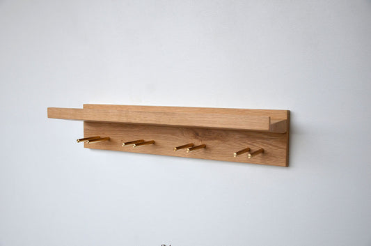gin shelf made from oak and brass