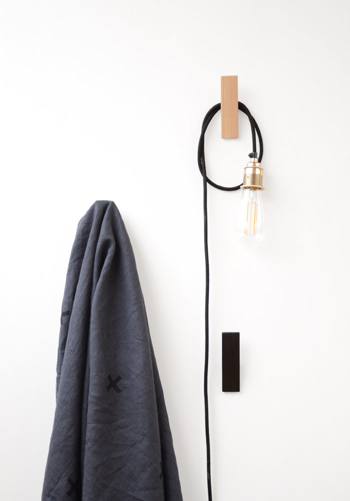 simple wooden wall hook made from ash with pendant lamp