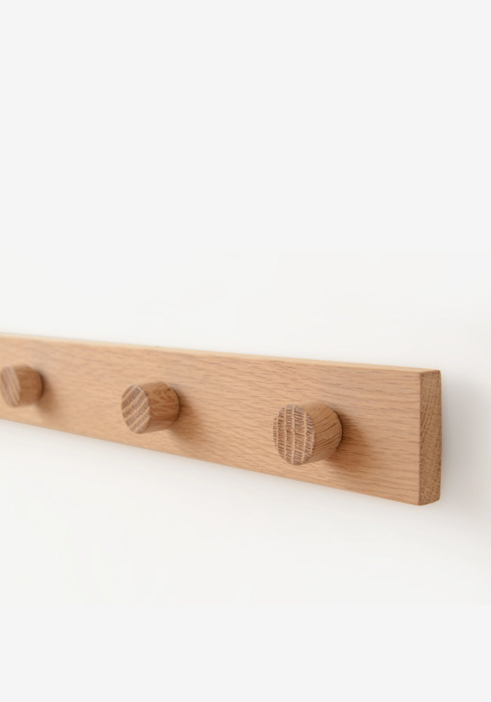 wall mounted magnetic modern notice rail made from oak