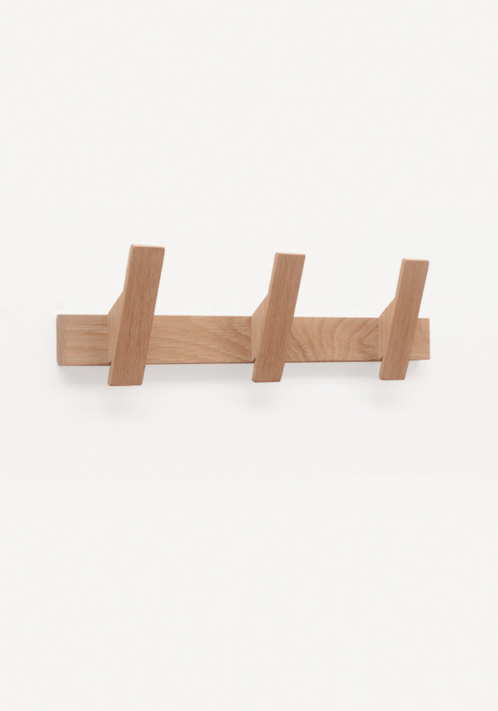 Solid oak coat rack with three hooks. Minimalist, contemporary style.