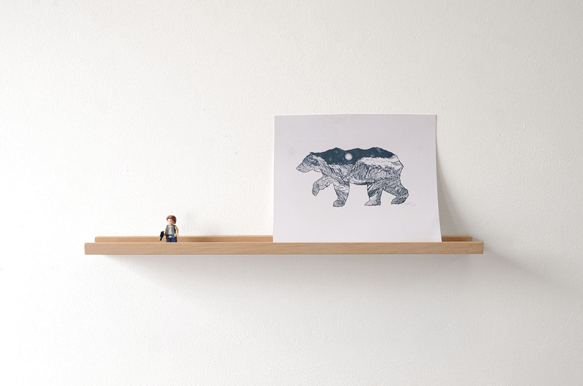 floating shelf made from oak with picture and toy
